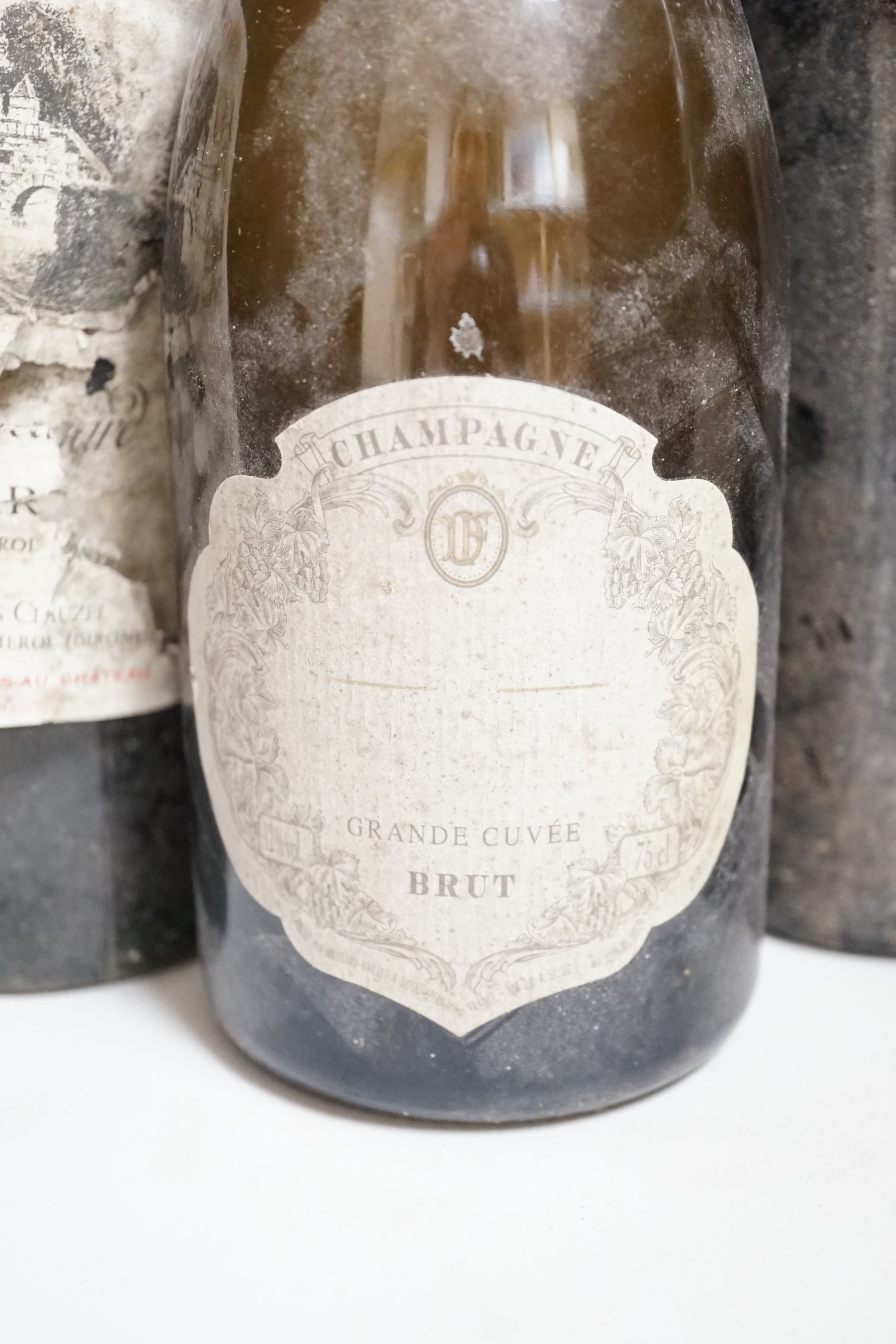 Three bottles of Chateauneuf-du-pape, One bottle of Pomerol, one bottle of port and one bottle of champagne